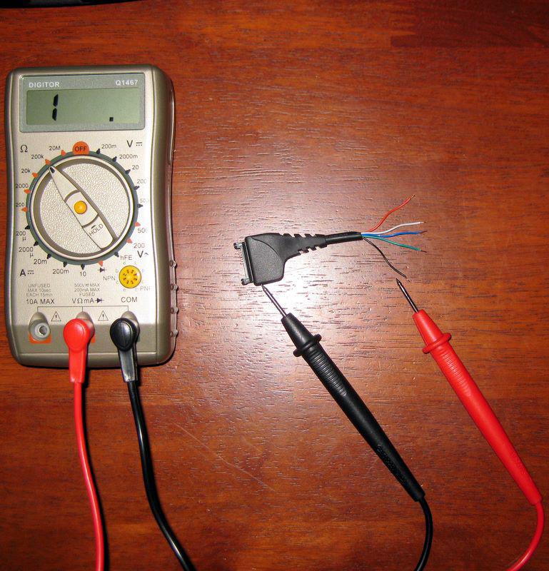 A multimeter showing continuity between connector and wire
