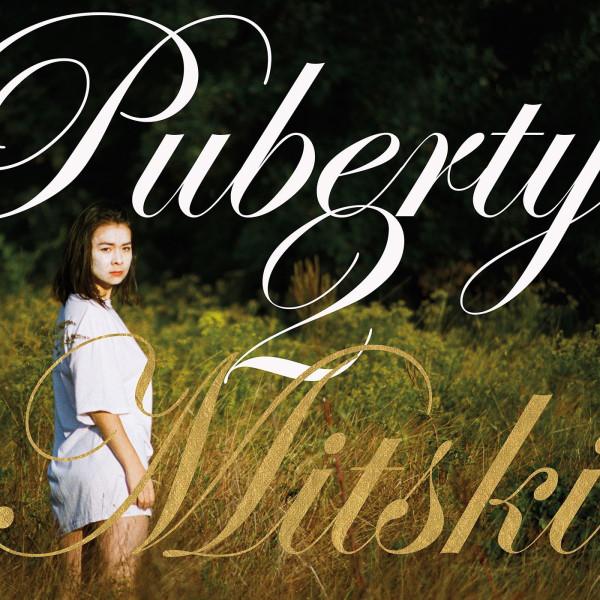 Album cover showing a woman in a field with the title overlaid