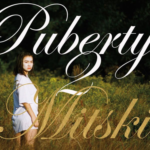 Album cover showing a woman in a field with the title overlaid